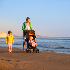 Mother with children on the beach
